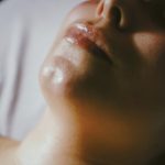 a woman getting a facial massage on her face